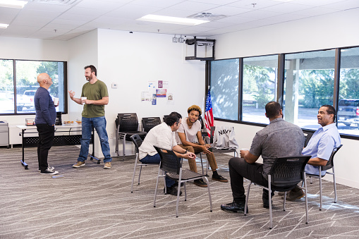 The diverse group of male veterans talk candidly as they meet at the VFW for their social gathering.