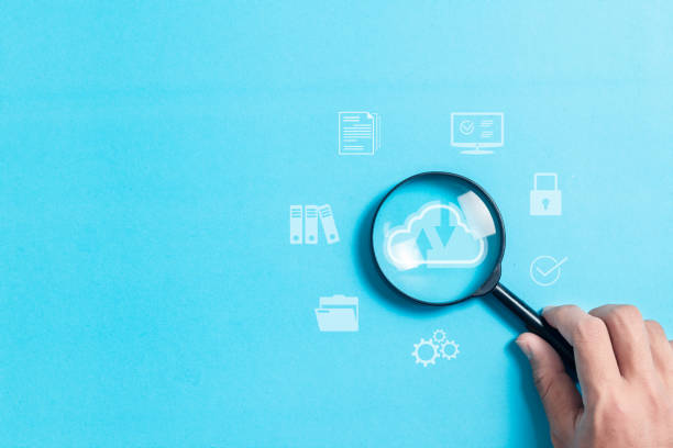 istock Hand holding magnifying glass focus to cloud technology icon for cloud storage network technology. large network of backup platforms, Data storage for business networks with cyber security software. 2008001053
