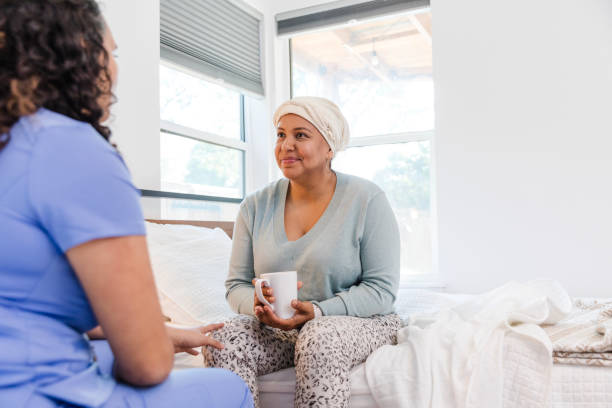istock Unrecognizable female nurse talks with her patient 2008011634