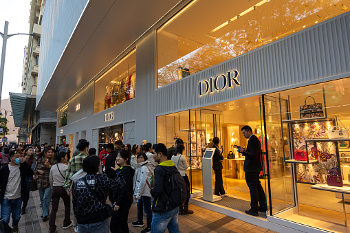 Hong Kong - February 13, 2024 : Shoppers queue at a Dior store in the Canton Road, Tsim Sha Tsui, Kowloon, Hong Kong.