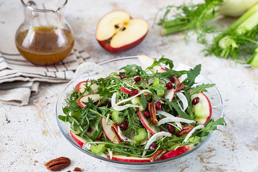 Fresh salad with apples, fennel and nuts