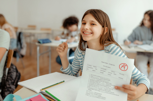 Portrait of Smiling Schoolgirl With Perfect Grade