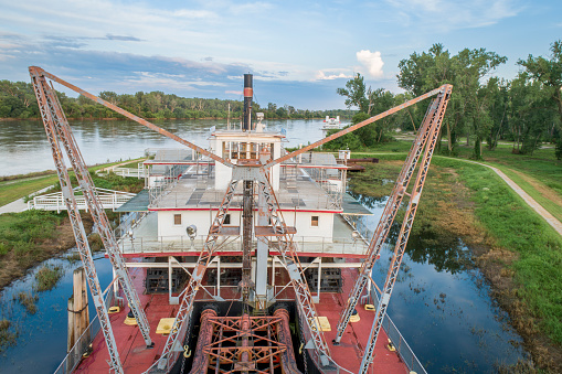Brownville, NE, USA - July 30, 2018:  Historic dredge, Captain Meriwether Lewis, in a dry dock on a shore of Missouri River.