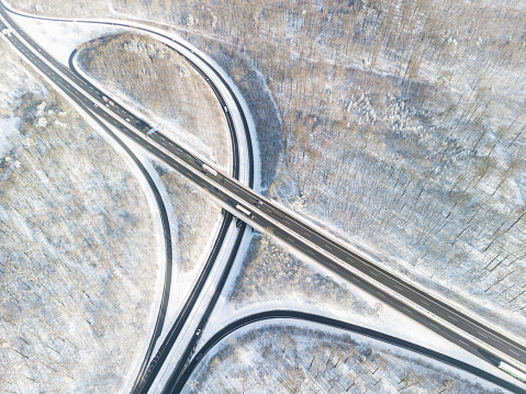 High angle view of a motorway intersection in the snowconvert winter landscape