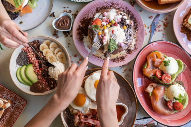 istock Breakfast is served with various dishes including eggs, bacon, pancakes and fruits 2008136370