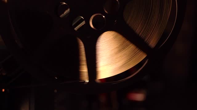 Retro vintage movie projector on a dark background