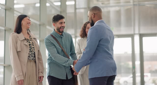 Group, meeting or happy business people shaking hands in office for CRM, b2b negotiation or discussion. Smile, greeting or worker with handshake to welcome an employee speaking of partnership deal