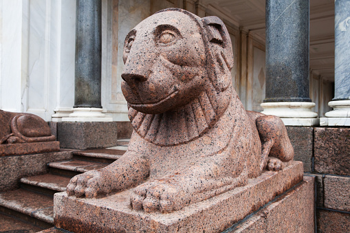 Granite lion at the entrance of The marble Voronikhin colonnades received their name after their creator, the former serf Andrei Voronikhin. It was built in 1800-1803