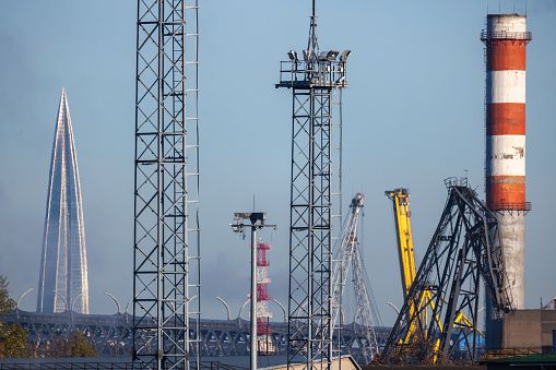 Industrial view with chimneys and cranes in port of Saint Petersburg, Russia