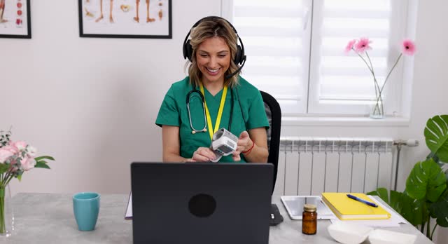 Doctor engaging in web conference with patient