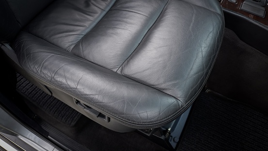 Black leather passenger seat showing the bottom