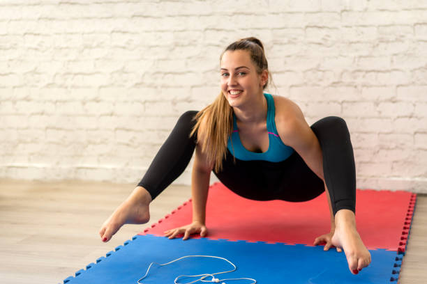 istock A woman practices yoga and muscle stretching exercises 2008299701