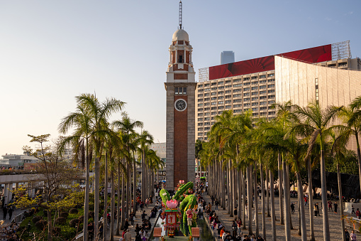 Hong Kong - February 13, 2024 : Hong Kong Cultural Centre and Former Kowloon-Canton Railway Clock Tower in Hong Kong.