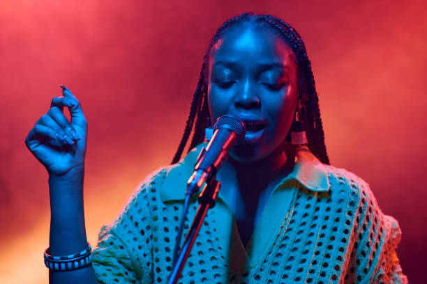 istock Black Woman Singin g into Microphone in Neon Lights 2008322247