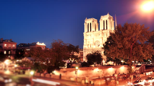Busy streets by the Notre Dame Cathedral at night