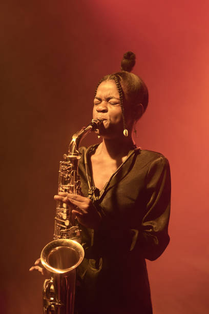 istock Black Woman Playing Saxophone Jazz Music on Stage 2008322823