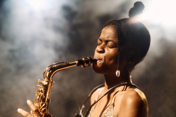 istock Black Woman Playing Saxophone on Stage 2008323364