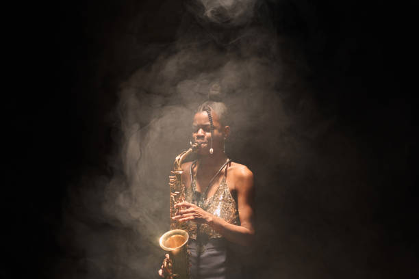 Woman playing saxophone and performing jazz