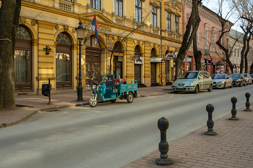 Electric tricycle with cargo platform CSM2017 KING KONG GF500 is parked. Electric rickshaw (tuk-tuk) - is only truly affordable electric commercial vehicle for now.  Serbia, Subotica, 18.03.2023