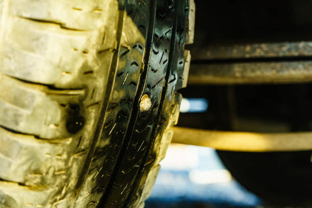 istock The nail is embedded in the broken tire. 2008369682