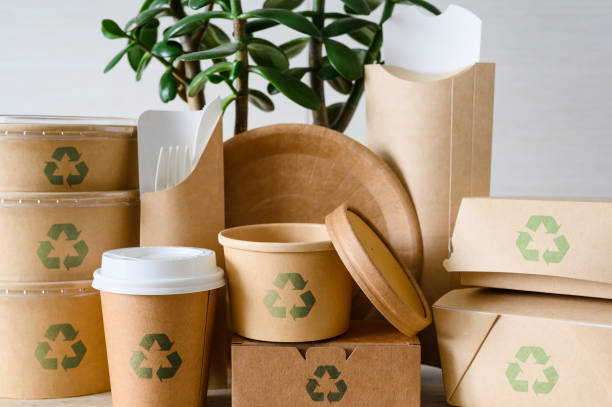 istock Recycling signs on disposable tableware. Close-up of eco-friendly tableware for a picnic or for fast food with a symbol of recycling. 2008381979