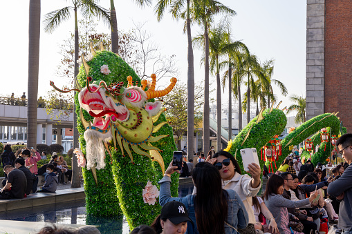 Hong Kong - February 13, 2024 : A large dragon is displayed at the Hong Kong Cultural Centre Piazza to celebrate the Chinese New Year festival and the Year of the Dragon.