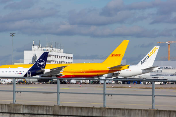 Amsterdam Schiphol Airport, North Holland/the Netherlands - October 17 2024: Lufthansa passenger aircraft near air traffic control and radar tower at Schiphol airport