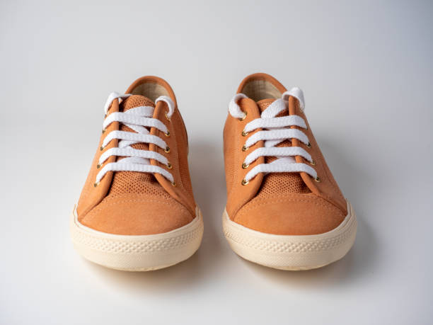 istock Front view of a pair of light brown sneakers standing on a white background. Studio shot. Leather, suede 2008425729