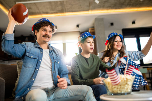 istock Family is watching rugby match with American flags. 2008432010