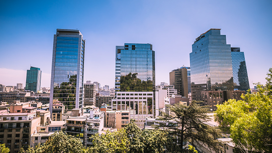 Skyscrapers with modern glass facades and other buildings in Santiago de Chile