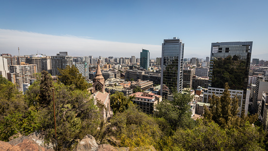 The skyline of Santiago de Chile with skyscrapers and historic buildings