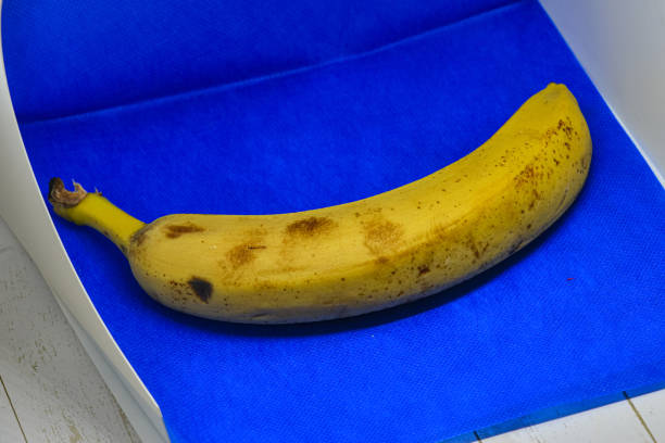 istock Yellow banana on blue background 2008523176