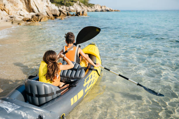 istock Teenagers having fun with inflatable raft on their summer vacation 2008569668