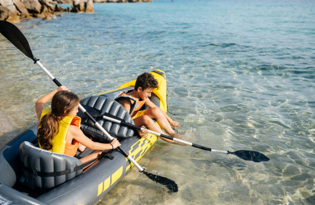 istock Teenagers having fun with inflatable raft on their summer vacation 2008570184
