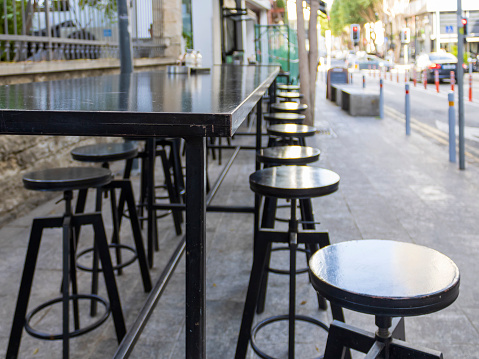 Wooden cafe tables and chairs in the Montmartre district of Paris