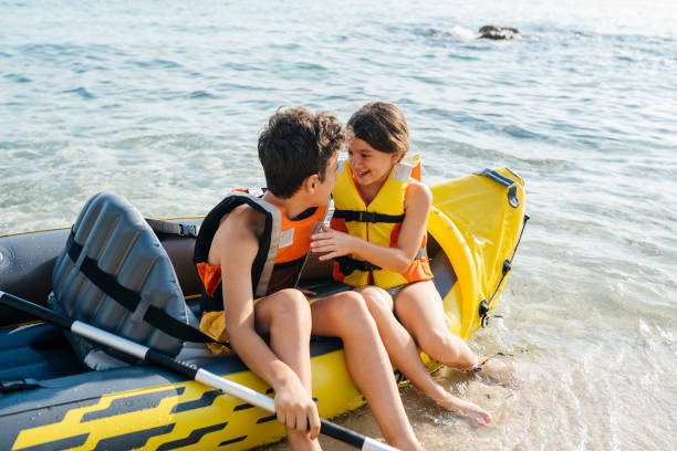 istock Teenagers having fun with inflatable raft on their summer vacation 2008571256
