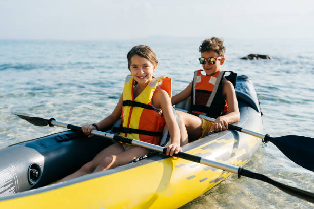 istock Teenagers having fun with inflatable raft on their summer vacation 2008574501