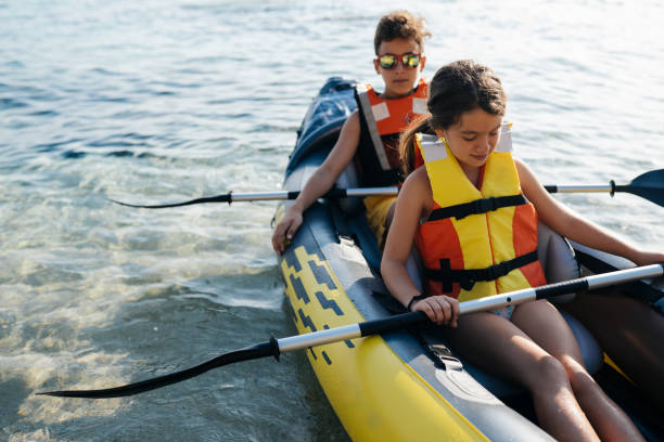 istock Teenagers having fun with inflatable raft on their summer vacation 2008575565