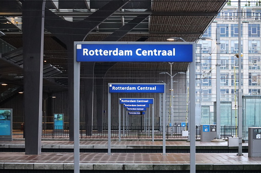 Blue nameplates on the platform of Rotterdam Centraal station in the Netherlands