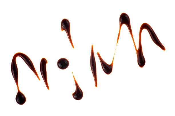istock Drops of balsamic vinegar isolated on s white background, top view. Balsamic vinegar cream, Italian salad dressing. 2008592229