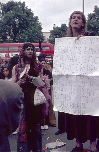 London, England, UK, 1972. Hippies with a message and park visitors at Speakers Corner in London's Hyde Park.
