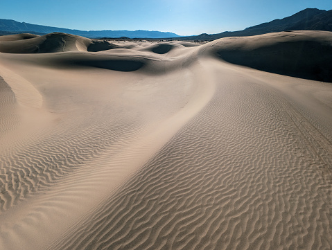 Death Valley National Park, Salt with clay, California. Smooth salt valley with cracked and swollen salt, dead salt landscape