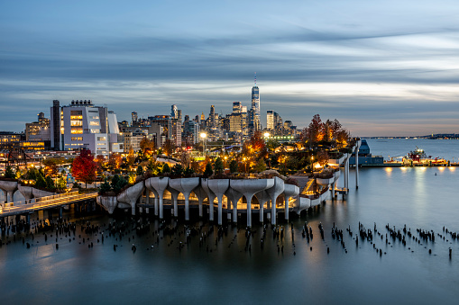 Historical Little Island in the Hudson River adjoining Hudson River Park west of Manhattan in New York City seen from Pier 55 and captured during sunset hour.