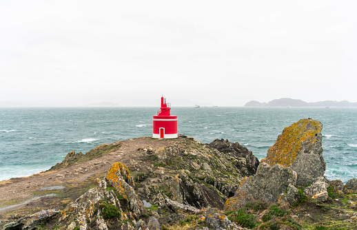 Red lighthouse in the north of Spain. Punta Robaleira lighthouse