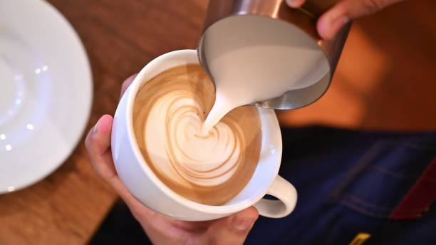 istock Professional Barista Pour fresh milk Create image on coffee latte art. 2008651777