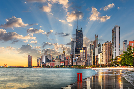 Modern tower buildings or skyscrapers in business district, reflection of cloud on sunny day in Chicago, USA. Advanced construction industry, modern company, or real estate project development concept