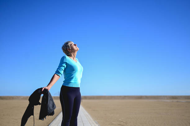 istock Senior woman feeling freedom outdoors in remote location. 2008721233
