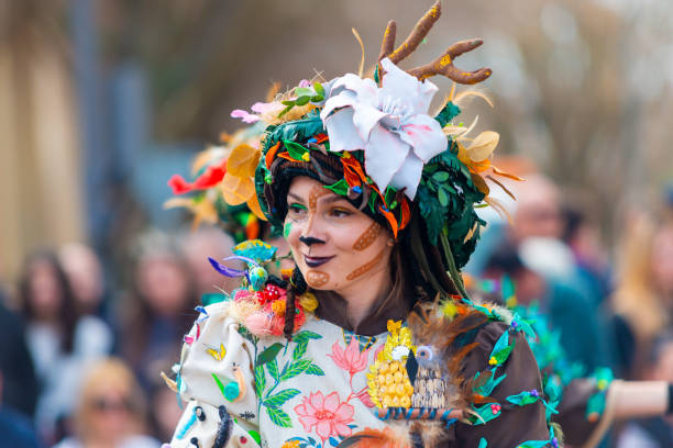 Basel, Switzerland - February 28, 2023: Carnival participants in costumes during the annual traditional carnival parade in Basel, Switzerland