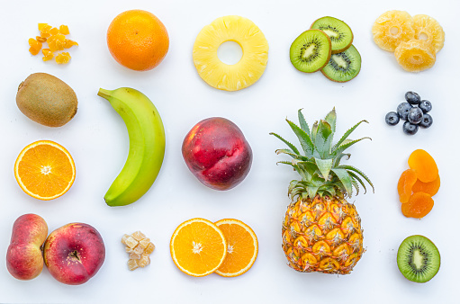 Assortment of various colorful fruits on white background
