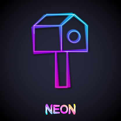 Glowing neon line Bird house icon isolated on black background. Nesting box birdhouse, homemade building for birds. Vector.